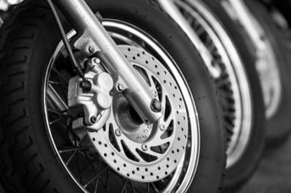 What are the main causes for the front tire of a motorcycle to