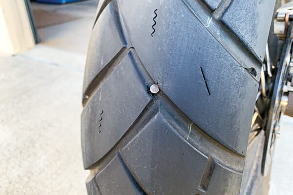How long can I ride on a plugged motorcycle tire