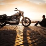 man and motorbike sunset