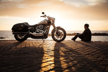man and motorbike sunset